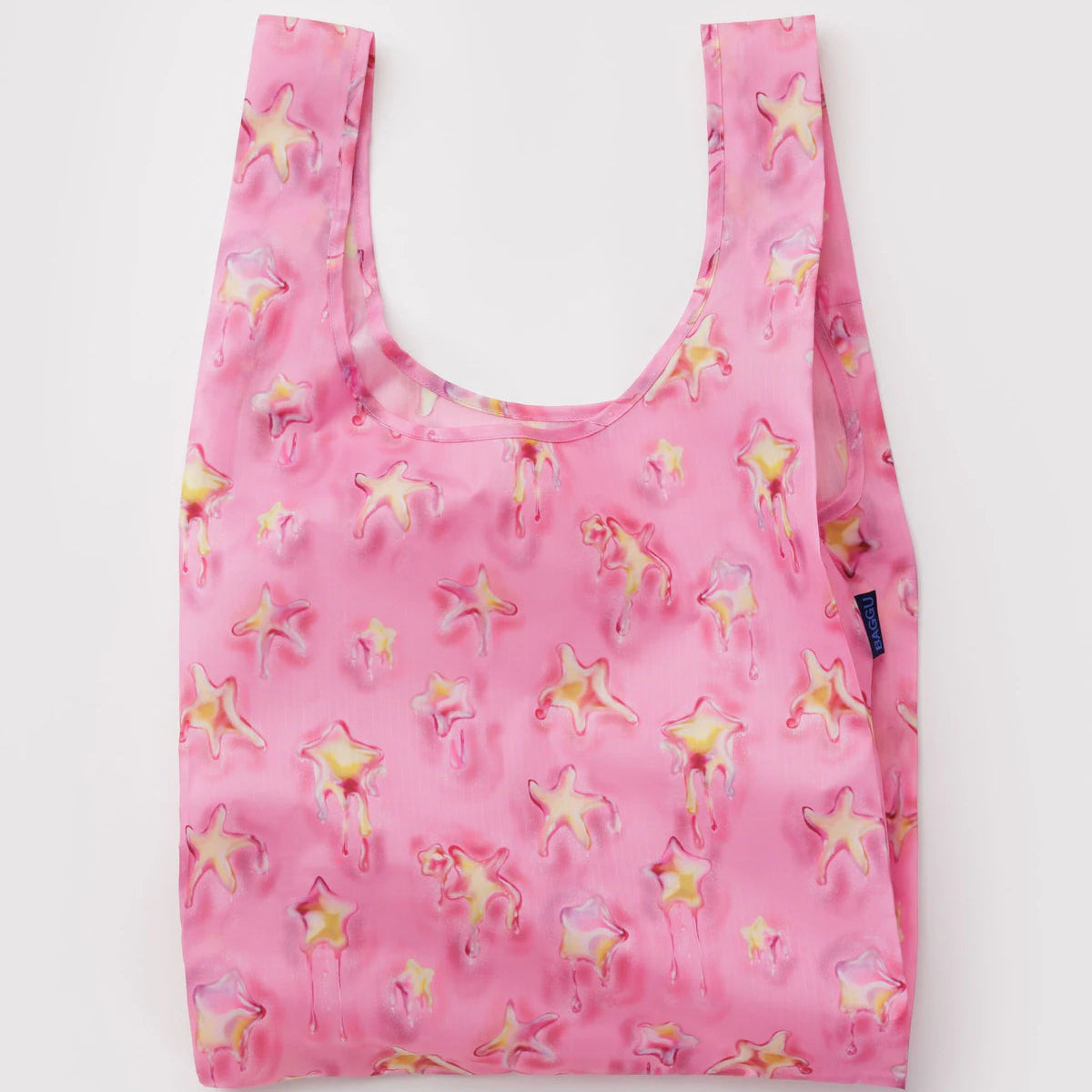 Pink reusable bag with star pattern on a white background