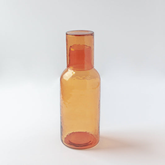 Amber glass bottle on a white background