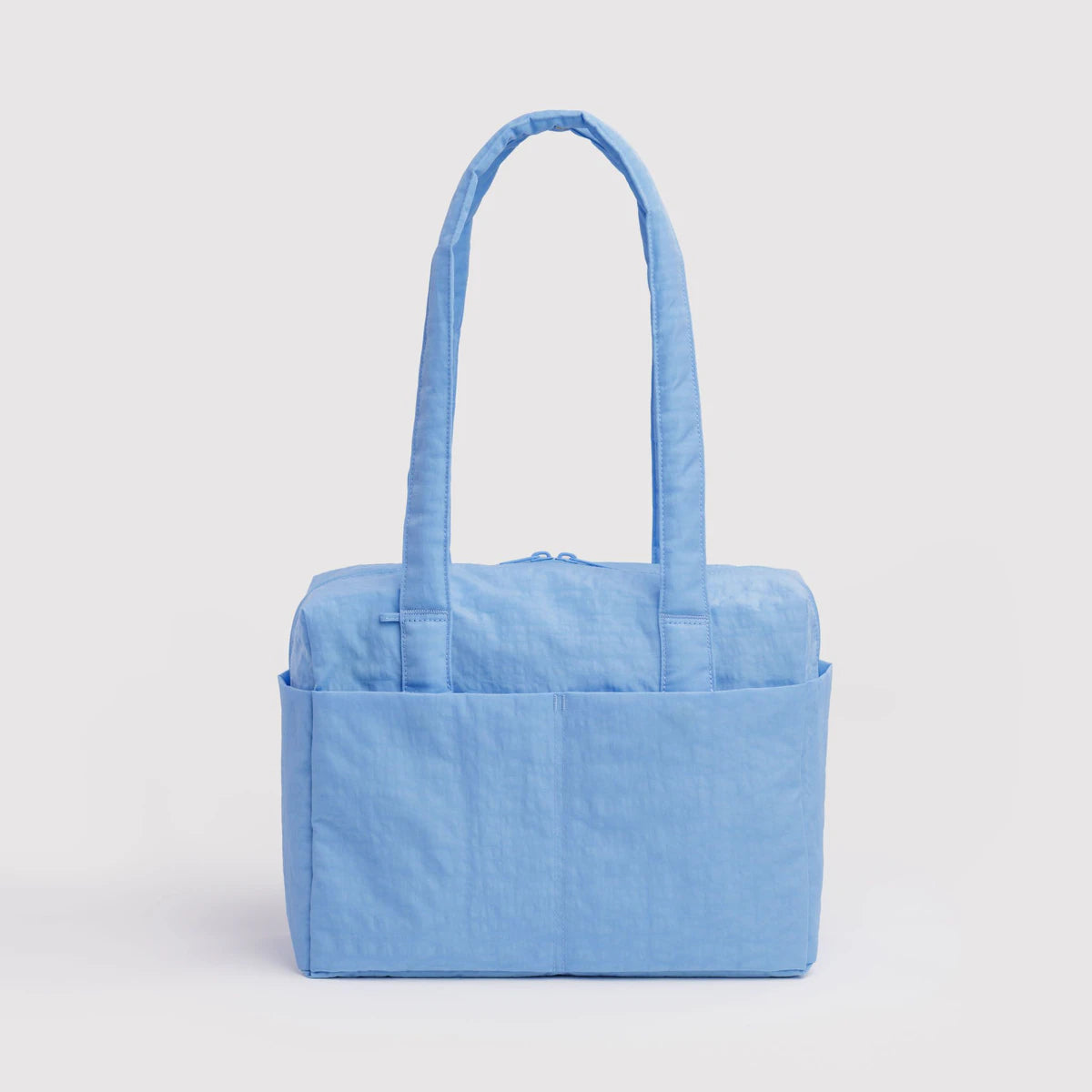 Light blue tote bag on a light gray background