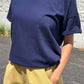 Her Tee