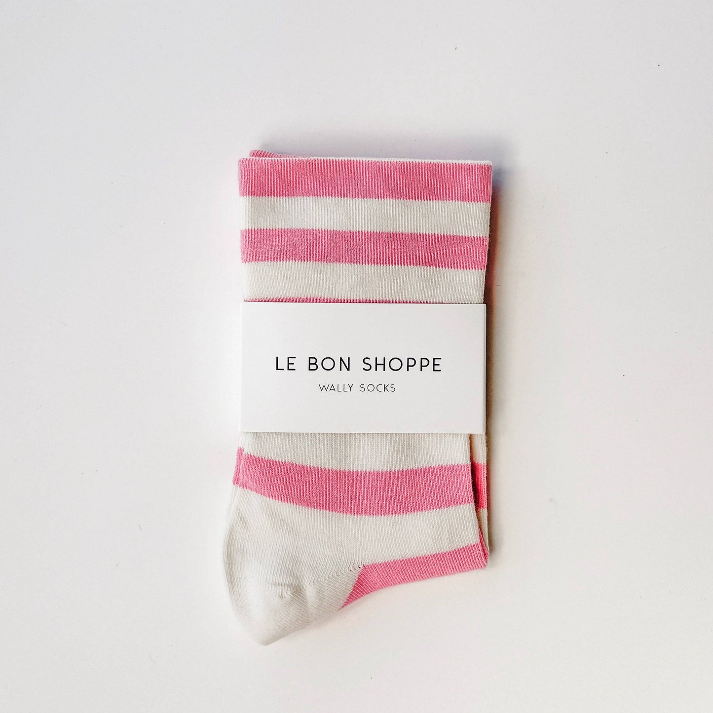 Pack of pink and white striped socks with 'Le Bon Shoppe' branding on a light gray background