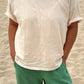 Her Tee