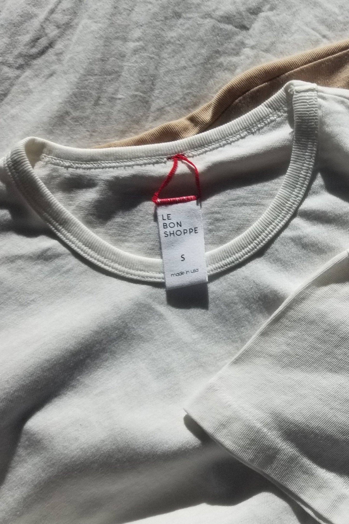 Her Tee