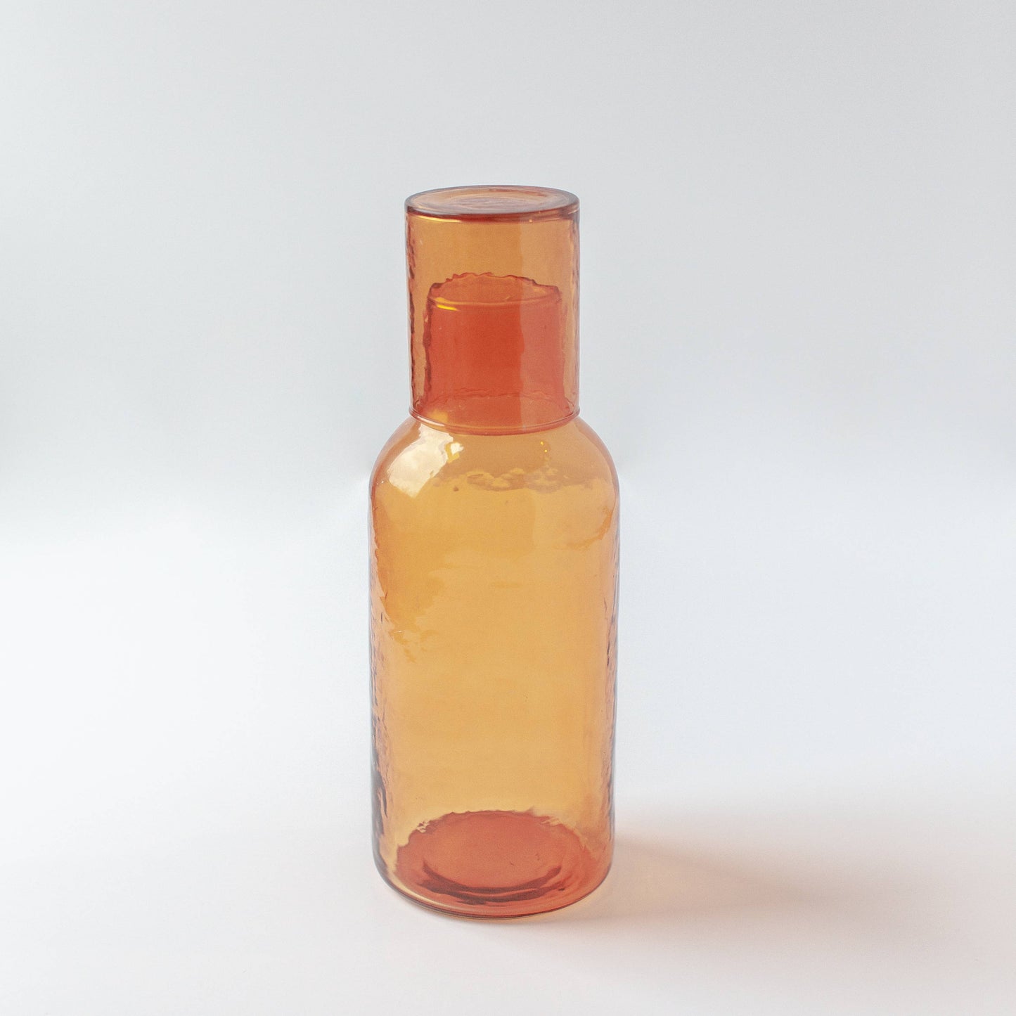 Amber glass bottle on a white background