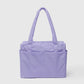 Purple tote bag with a handle on a light gray background