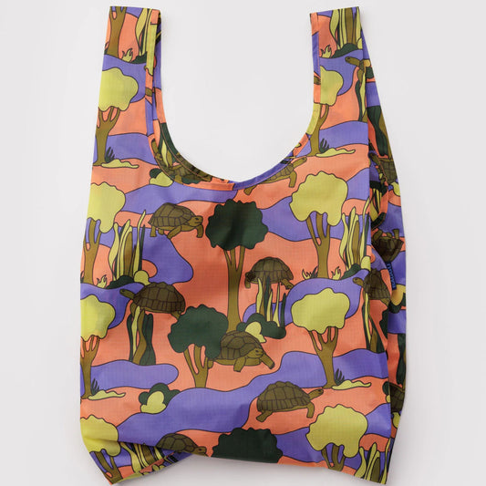 Reusable bag with a colorful forest pattern on a white background